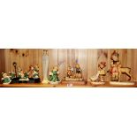 A quantity of Hummel figurines.