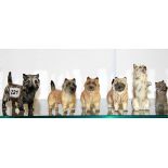 Six small Beswick dog figures.