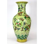 A mid 20th Century Chinese hand enamelled porcelain vase decorated with butterflies, H. 43cm.