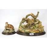 Two Country Artist's figures of otters, largest W. 33cm, H. 22cm.