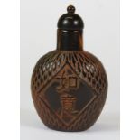 A Chinese carved horn snuff bottle, H. 8cm.