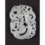 A finely carved jadeite jade dragon pendant, H. 5cm.