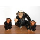 A Sylvac model of a chimp and two babies, largest 17cm.