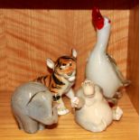 A Murano style glass duck, a Wedgwood elephant, a Russian porcelain tiger and a Nao monkey.