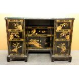 An Oriental style hand painted kneehole desk with plate glass top, 112 x 55 x 77cm.