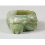 A carved jadeite jade lion dog ring, (R ).