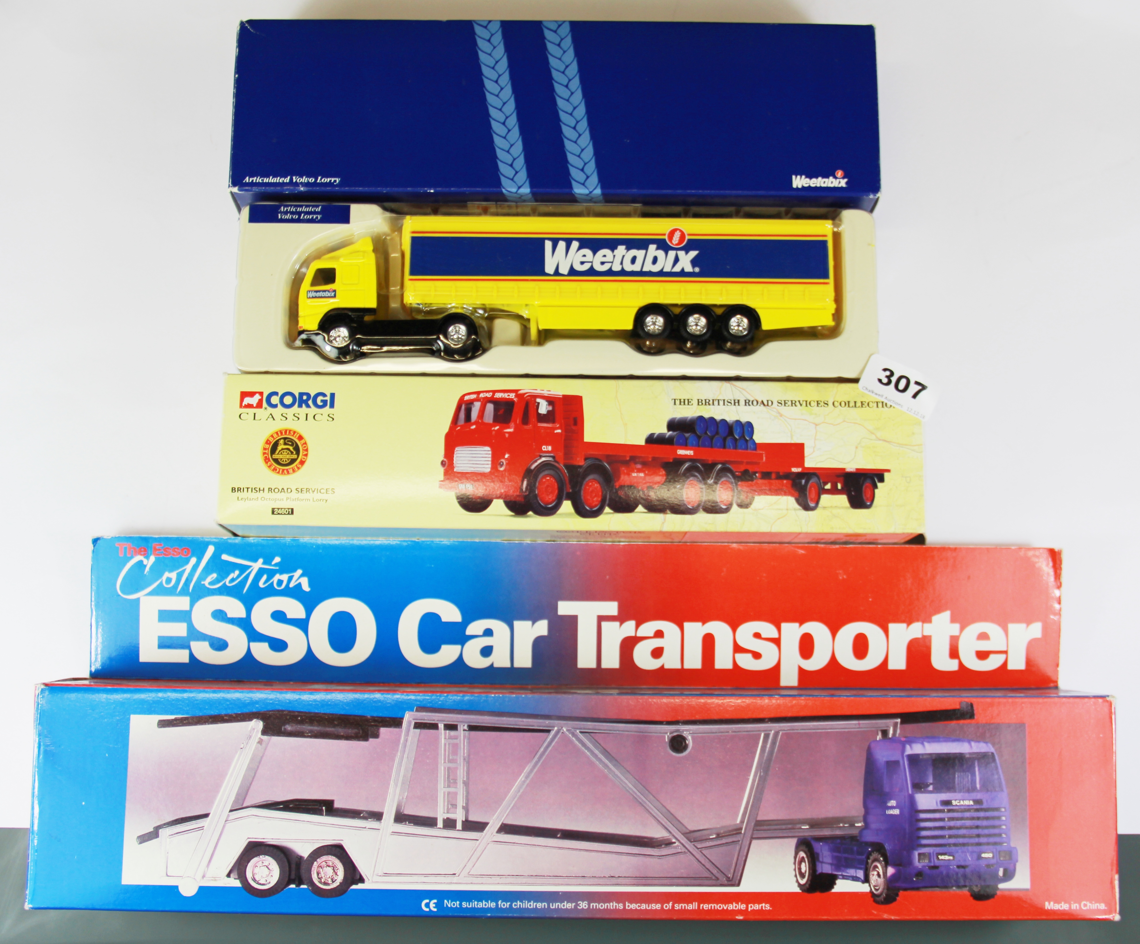 Three large die cast model vehicles.