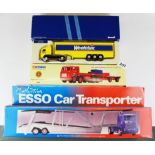 Three large die cast model vehicles.