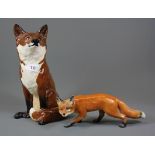 A large Beswick fox figure and a further Beswick fox, tallest 32cm.