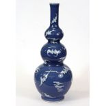 A Chinese triple gourd shaped tulip vase with embossed six character mark to base, H. 29cm.