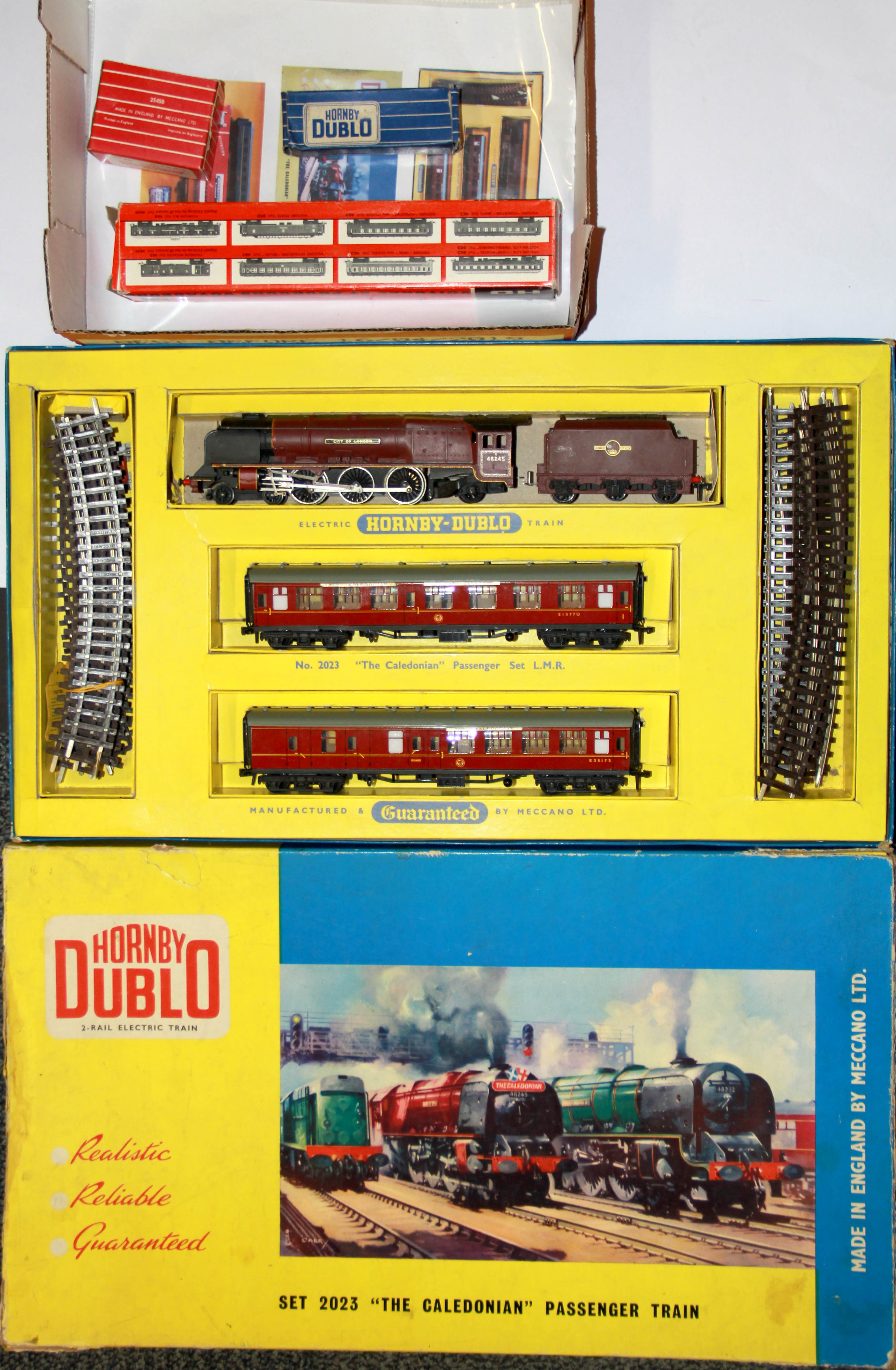 A Hornby 00 boxed Caledonian passenger train and other items.