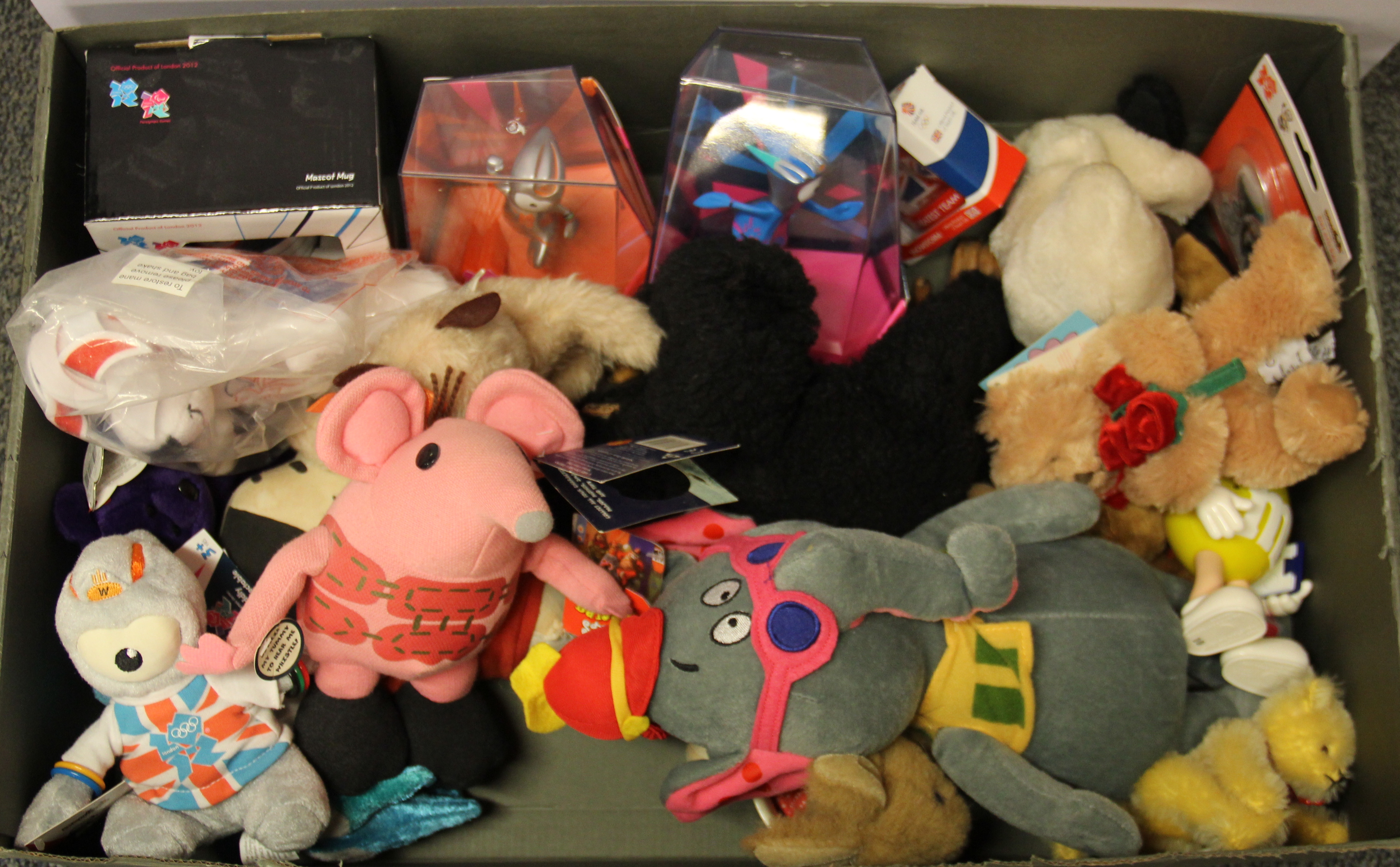 A box of mixed collectible soft toys.