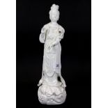 A mid 20th century Chinese Blanc de Chine porcelain figure of the goddess Guanyin, H. 36cm.