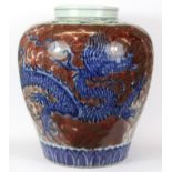 A 19th/ 20th Century Chinese porcelain vase with underglaze blue and red decoration, H. 31cm.