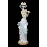 A Lladro porcelain figure of a lady, H. 36cm.