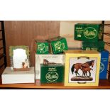 A quantity of boxed horse figures.