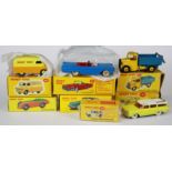 A group of seven Dinky die cast model vehicles.