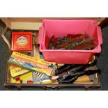 A vintage case of Meccano and other toys.