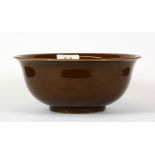 A Chinese brown glazed porcelain bowl with six character mark to base, H. 9cm, Dia. 20cm. Prov.