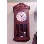 A German triple train oak cased wall clock, with pull repeat chime mechanism.