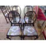 A set of four cameo backed side chairs, cabriole supports and drop-in seats.
