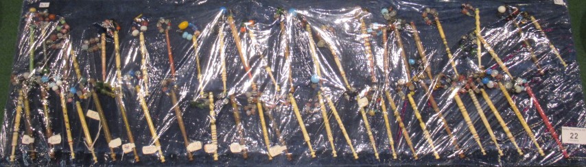 A collection of probably Bedfordshire wooden and bone lace bobbins, with spangled decoration,