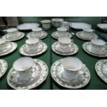 An early 20th century Ainsley tea service, comprising: twelve cups, saucers and side plates,