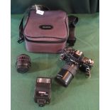 A Pratika SLR camera and accessories in fitted case.