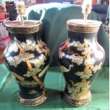 A pair of black Japanned Oriental-style baluster table lamps.