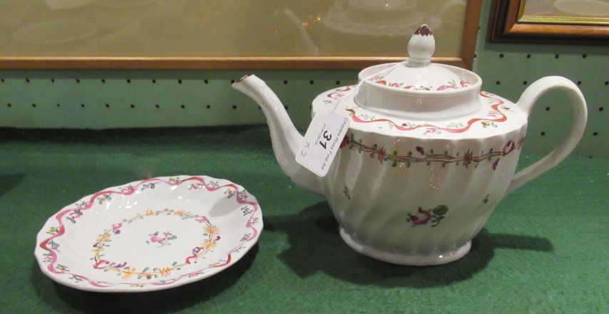 A late 18th century formerly factory ex Keeling & Co English porcelain ribbon bodied teapot and