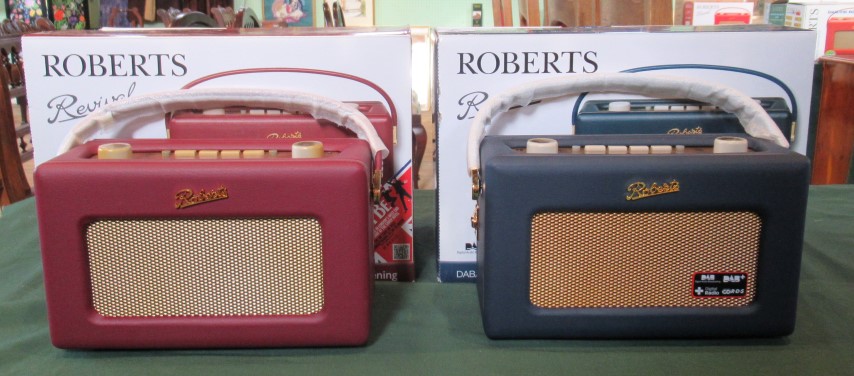 Two boxed Roberts Revival DAB radios.