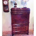A 19th century French figured mahogany bureau abattant with full front, containing fitted interior,