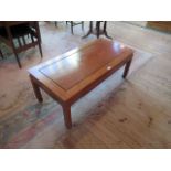 A Chinese rosewood low table. Condition Report: Reproduction. 107cm x 51cm.