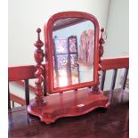 A Victorian mahogany swing toilet mirror with barley twist supports and shaped base.