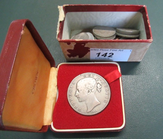 A cased 1844 Victorian silver crown, bearing the young head of Victoria,