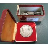 A cased 1844 Victorian silver crown, bearing the young head of Victoria,