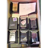 A collection of twenty boxed decorative Zippo petrol cigarette lighters.