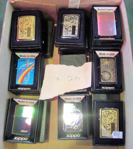 A collection of twenty boxed decorative Zippo petrol cigarette lighters.