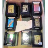 A collection of twenty boxed decorative Zippo petrol cigarette lighters.