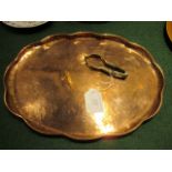 A 20th century H Barnes, The Forge, Thornton Le Dale Arts & Crafts-style tray with a petalled edge,
