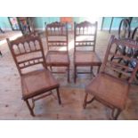 A set of four late 19th century French walnut side chairs,