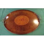 An Edwardian fiddle back mahogany oval gallery tray with fitted two gilt brass handles.