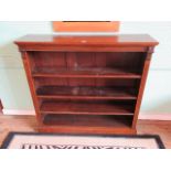 An Edwardian oak open bookcase with three adjustable shelves.