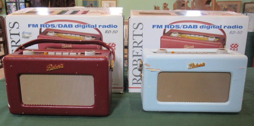 Two boxed Roberts DAB radios.