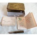 A 1914 brass Christmas tin, containing a period shell cased pencil.