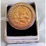A half sovereign set ring, the half sovereign dated 1913 in a substantial textured 9ct gold mount.