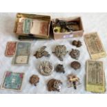 A mixed lot of military cap badges and buttons, including: RAF, Suffolk regiment, Cameron regiment,