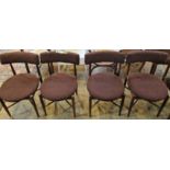 A set of four G-Plan teak framed dining chairs, each with bow rail,