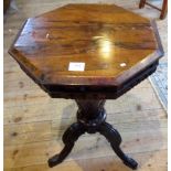 A Victorian rosewood trumpet form sewing box with fitted interior.