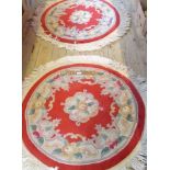 A pair of Chinese wool pile rugs, each of circular form,